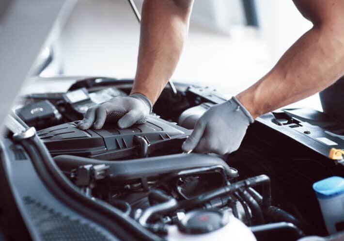 Auto mechanic working in garage. Repair service Auto mechanic working in garage. Repair service.