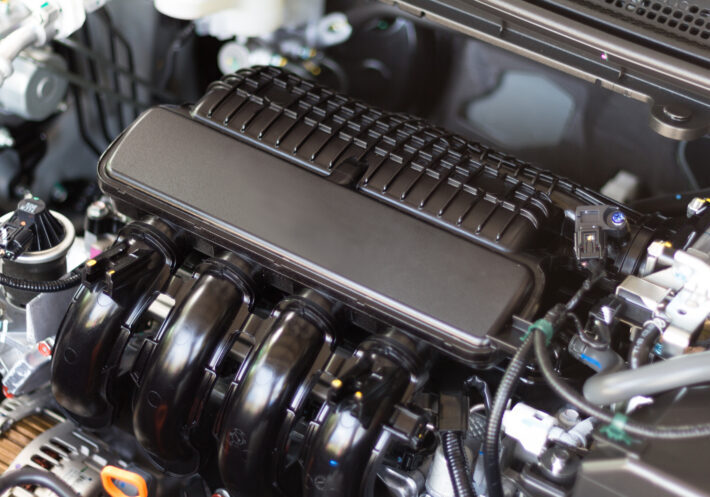 Close up detail of car engine with internal design of engine Close up detail of car engine with internal design of engine