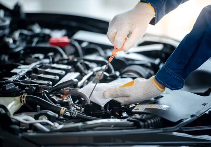 Asian car mechanic in an auto repair shop is checking the engine young asian, auto mechanic, repair service, asian mechanic, car repair shop, center, blue, happy, oil, labor, male, station, business, transmission, transport, wrench, man, mechanist, change, transportation, industrial, mechanical, industry, engineer, repairing, motor, repair, vehicle, mot, estimate, worker, budget, servicing, upkeep, workshop, technician, check, automobile, automotive, maintenance, auto, shop, mechanic, car, engine, inspection, garage, people, person, service