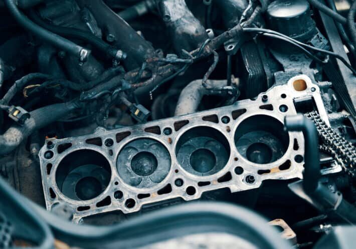 Engine, piston and cylinder block Auto mechanic working in garage. Repair service. The connecting rod, piston and cylinder block in a disassembled condition. maintenance repair at car service station for diagnosis. High quality photo